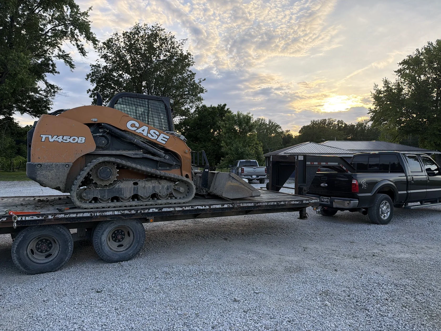 CASE track loader on a trailer, ready for equipment work.